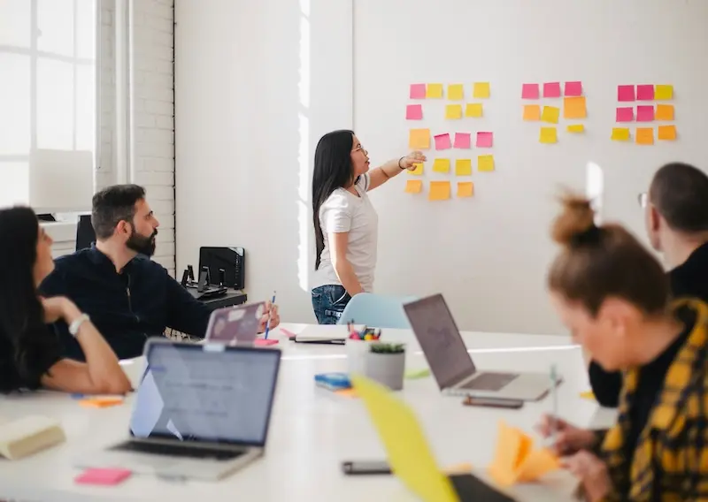 Live training and onboarding to help your team succeed. Group workshop training session representing team onboarding and live system walkthroughs.